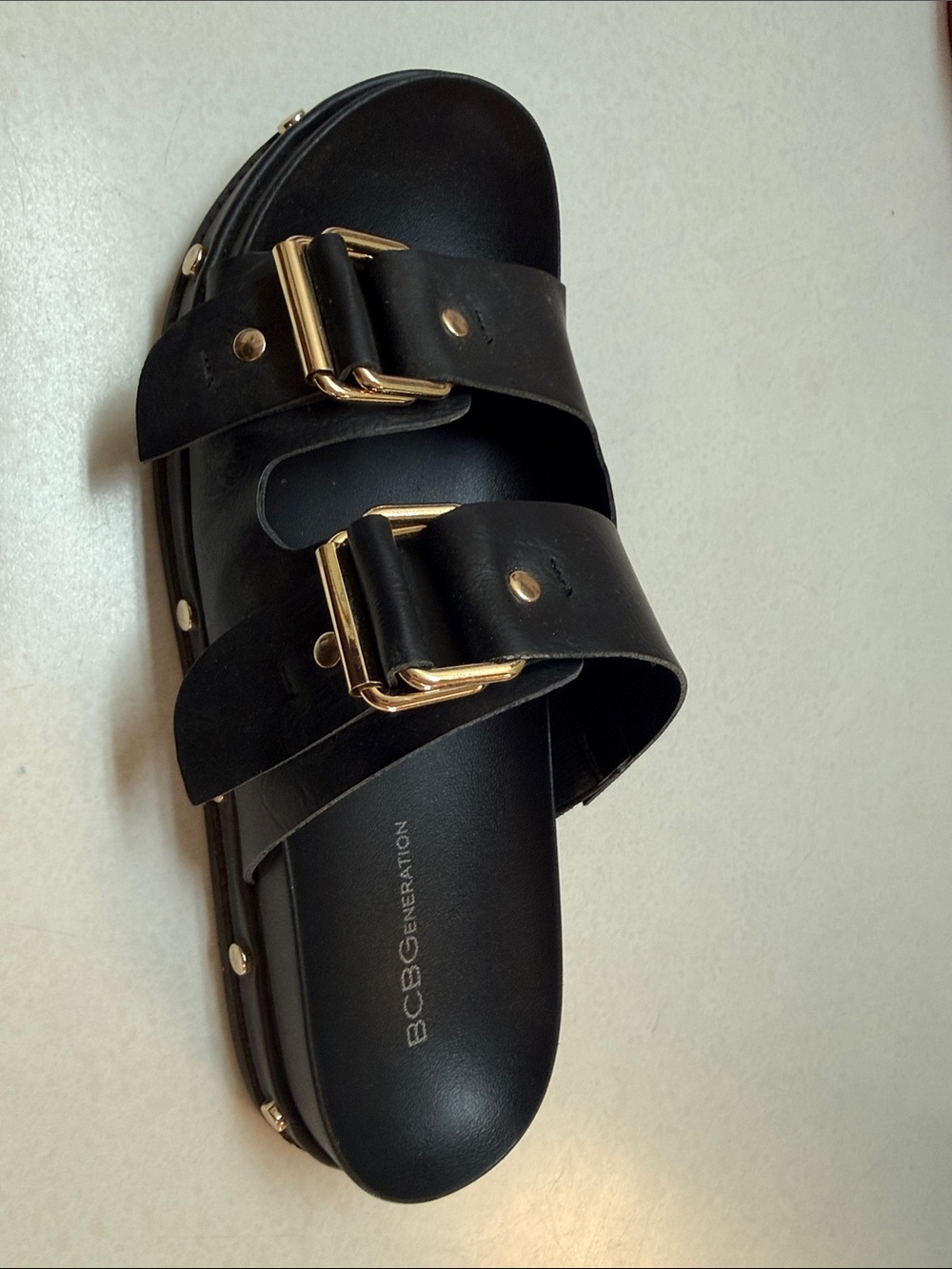 BCBG Black Leather Double-Buckle Slide Sandals with Gold Accents - Picture 2 of 2